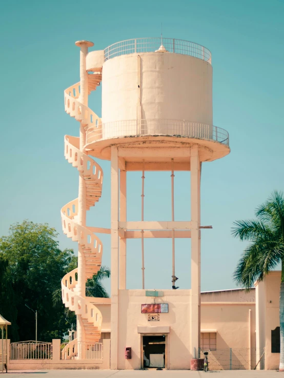 a tall building with a staircase going up the side