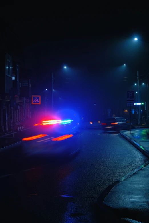 an image of a road with some lights in the background