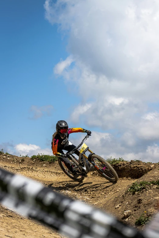 a man riding a bike on a dirt trail