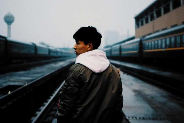 a man in front of an empty train station