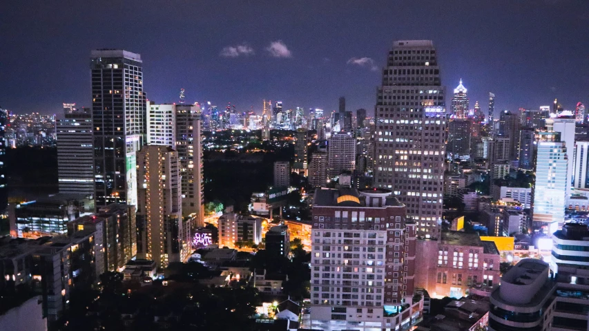 an urban cityscape at night with some lights on