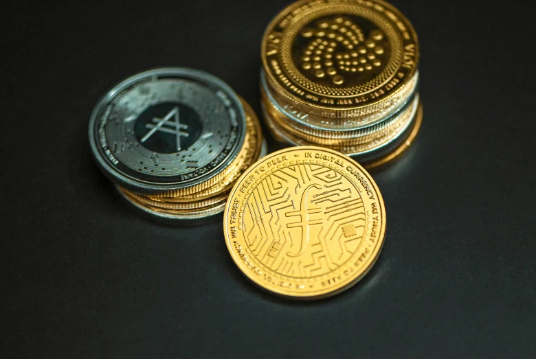 some bitcoins laying out on a dark surface