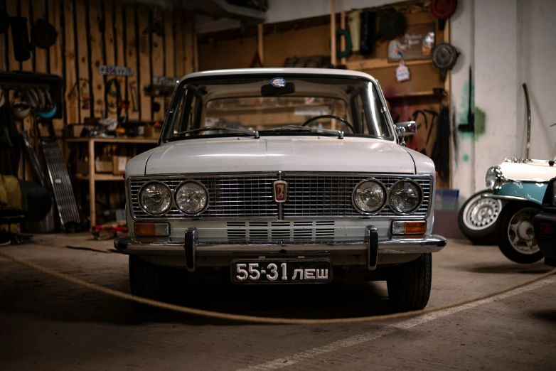 an old model car in a garage