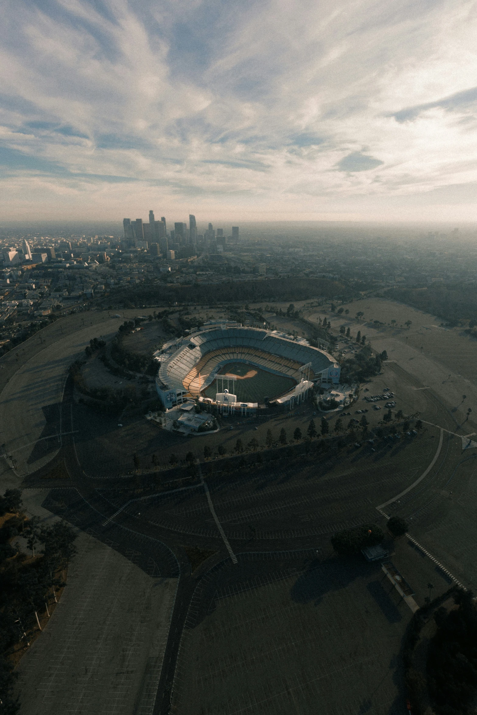 aerial view of a stadium surrounded by large buildings