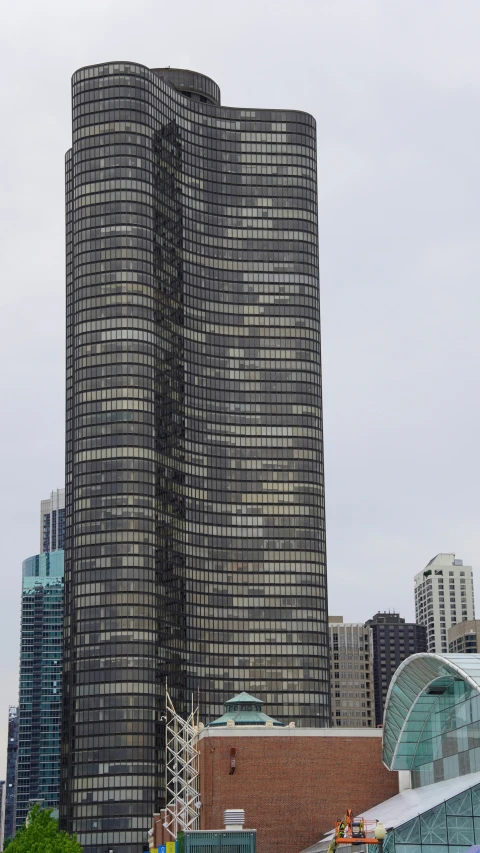 a tall building with skyscrs in the background