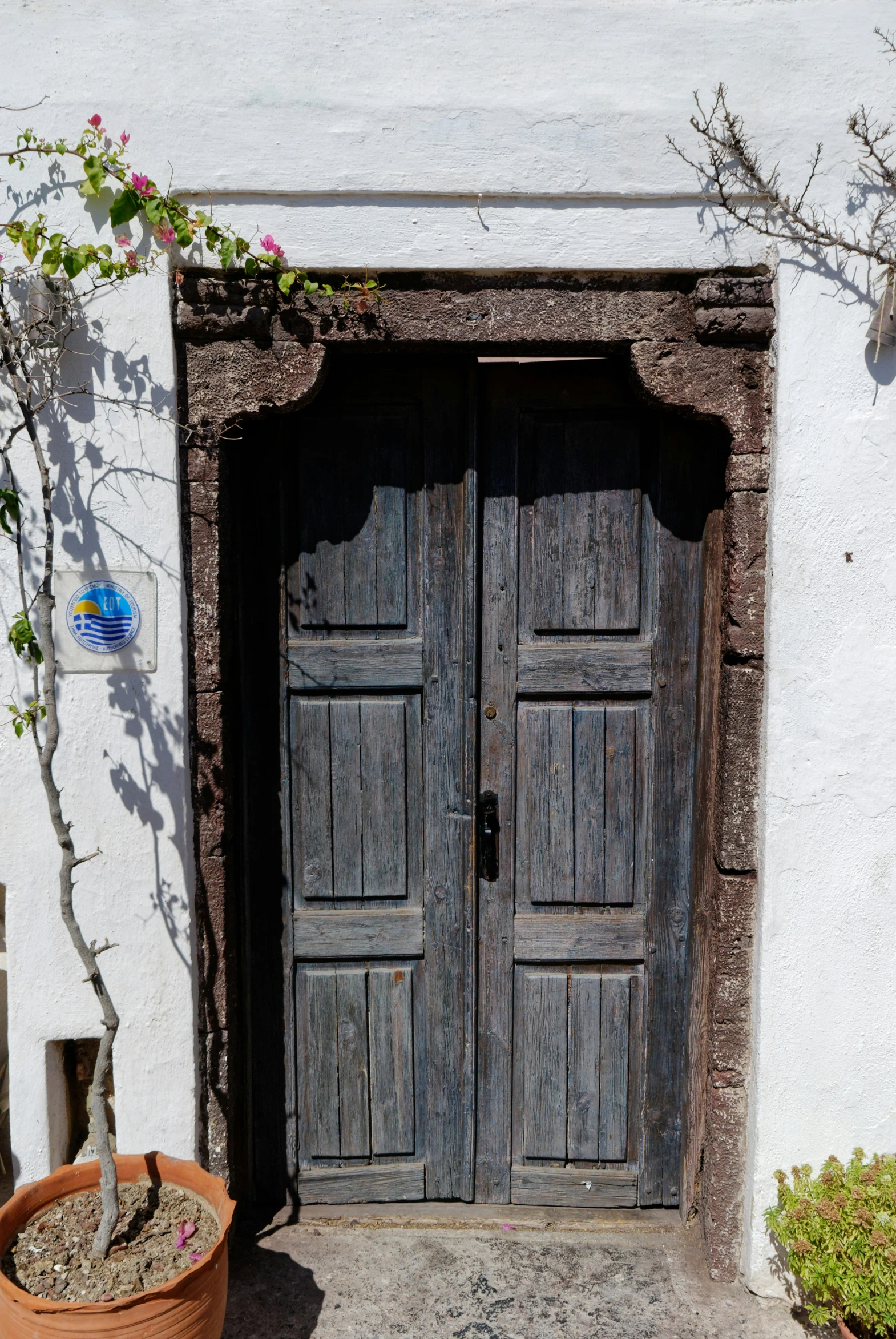 an empty door to an old, weathered building