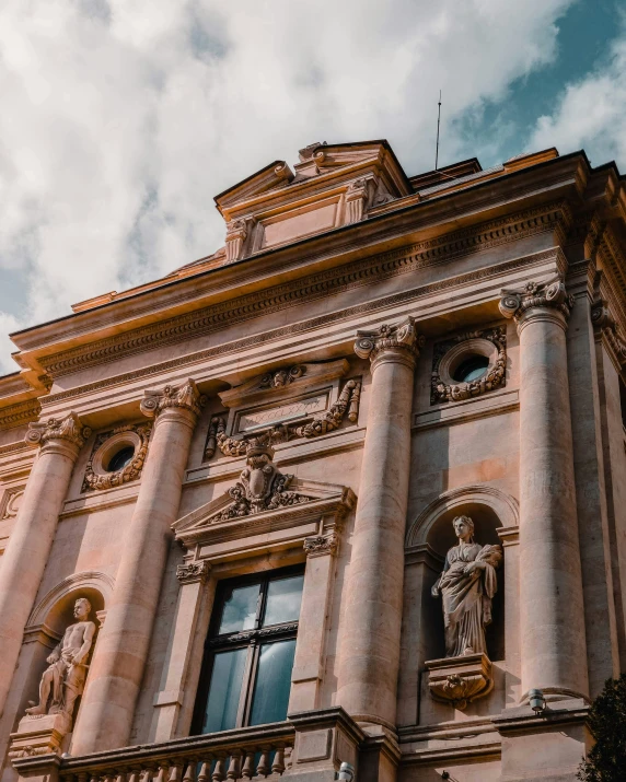 a building with many statues and windows on top