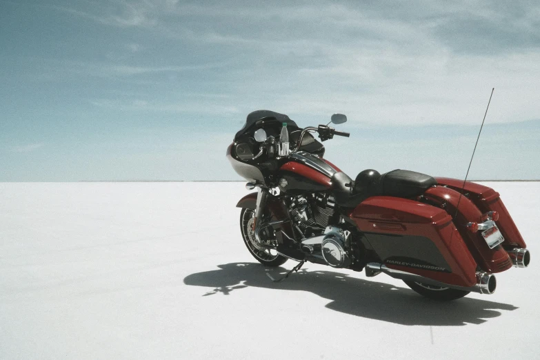 a red motorcycle parked in the middle of nowhere