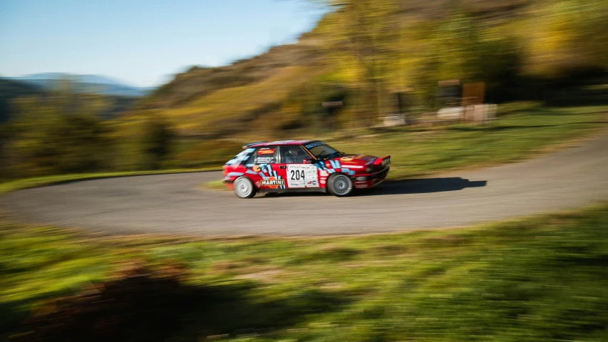 a car in a race driving down a country road