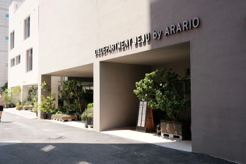 outside the building, a person walking out of the doorway