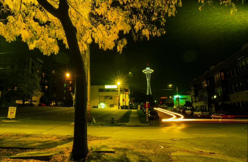 a view of a street with light from the headlights