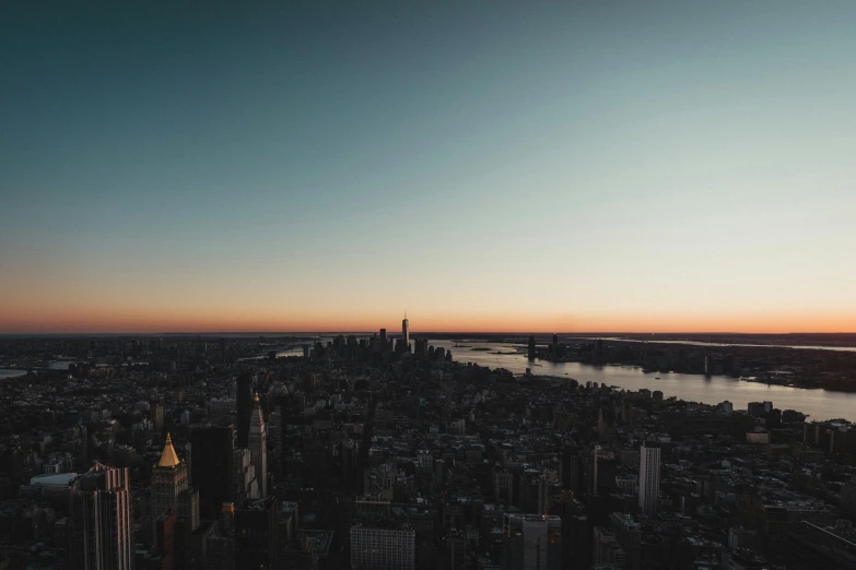 the city skyline and the water at sunset