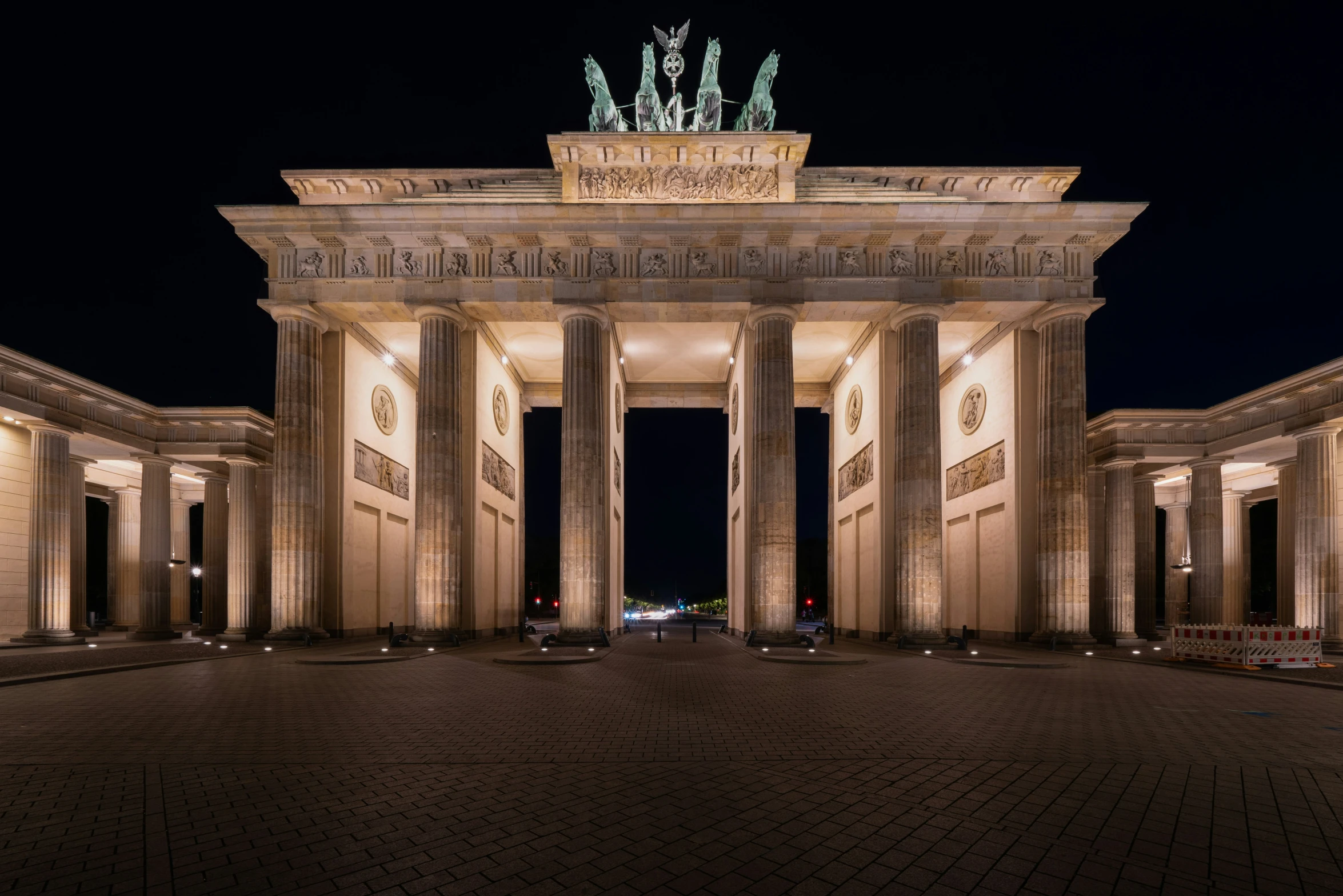 a pograph of a monument with columns at night