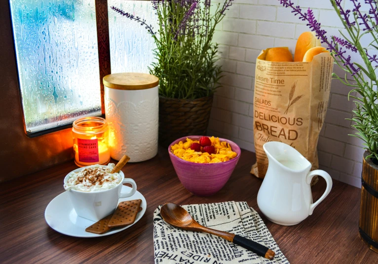 a table with cups of various kinds and spoons on it