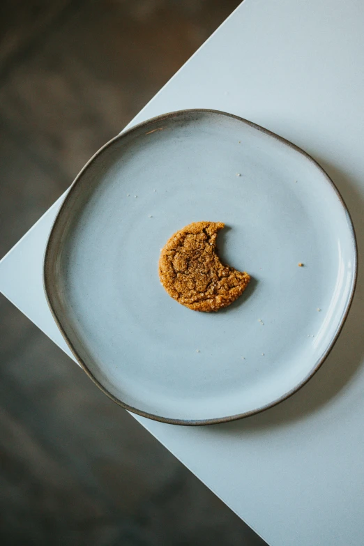 a cookie with half eaten on a plate