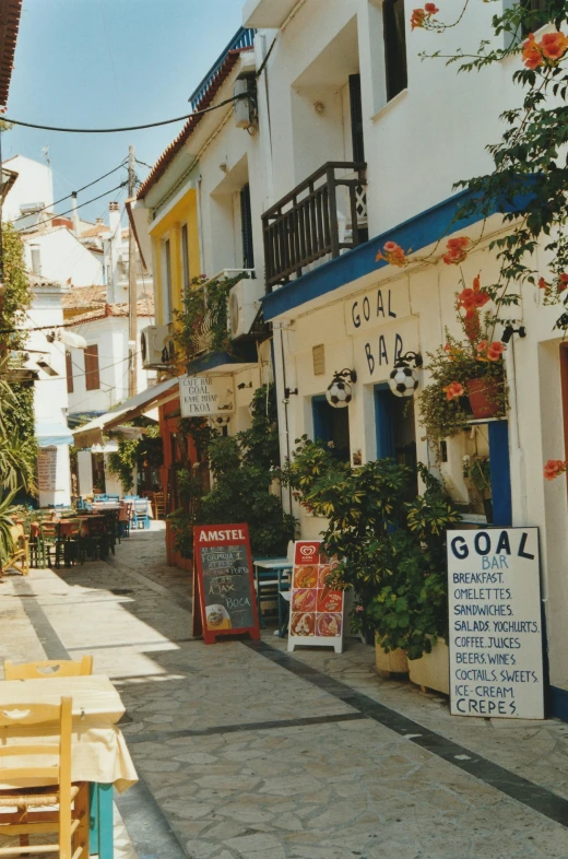 the sidewalk leading to an outside bar and restaurant