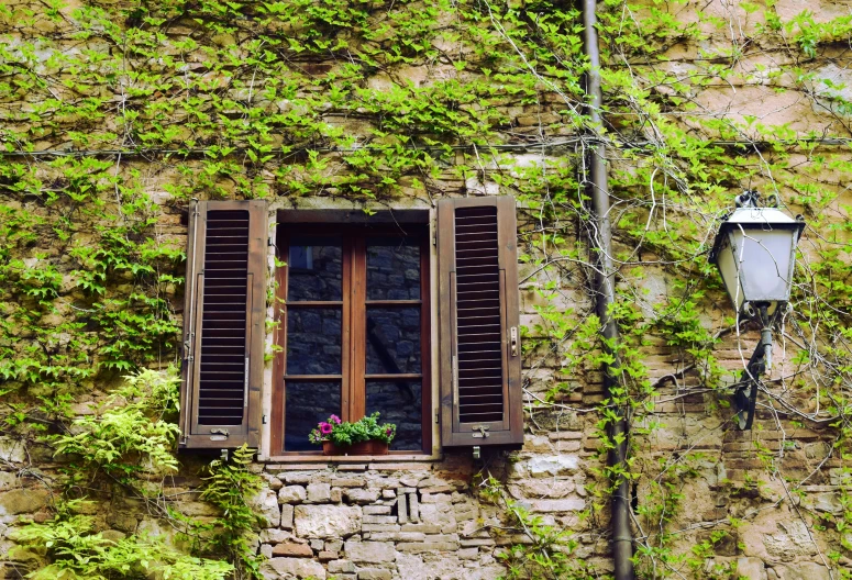 a window in a wall with windows above and below it