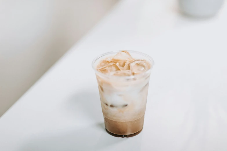 a drink sitting on top of a white counter