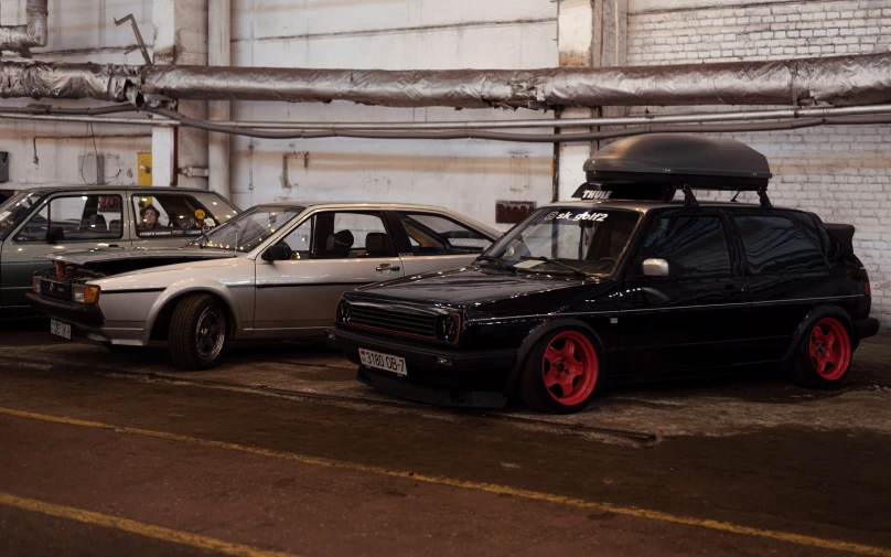 a picture of some cars parked by a building