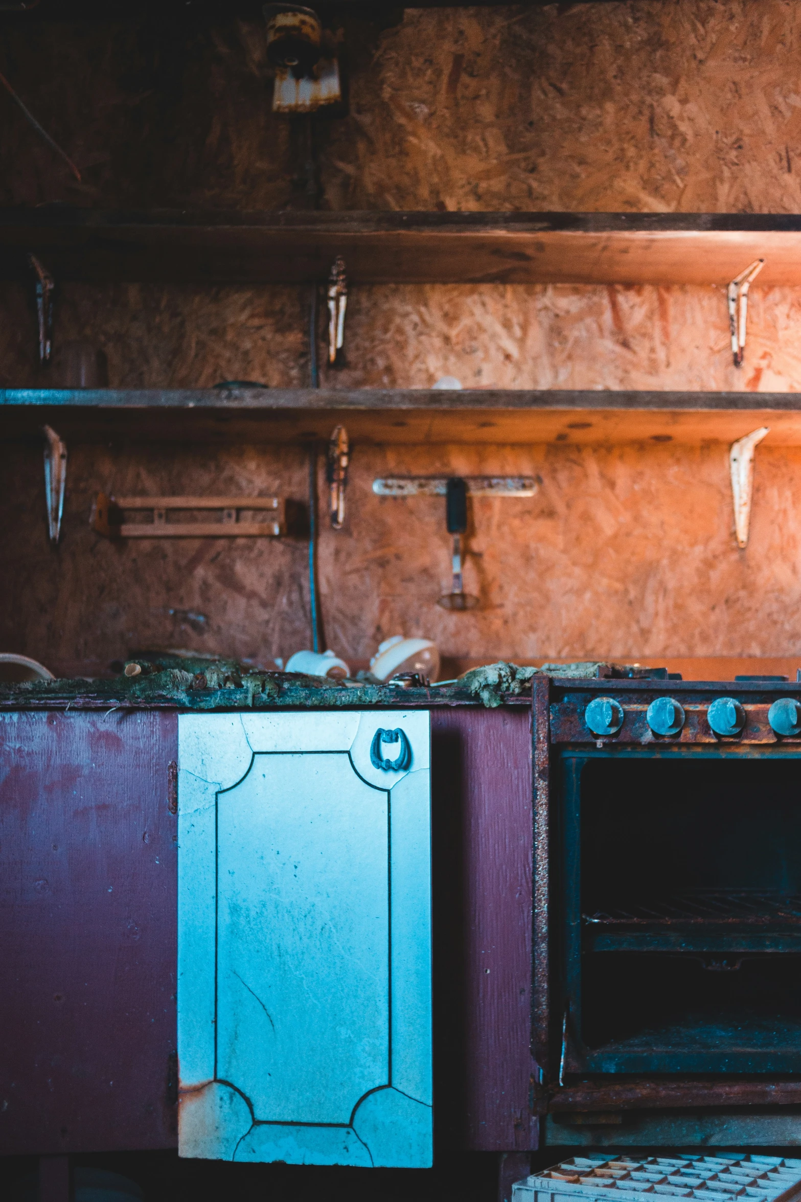 a stove and a microwave with a few cabinets