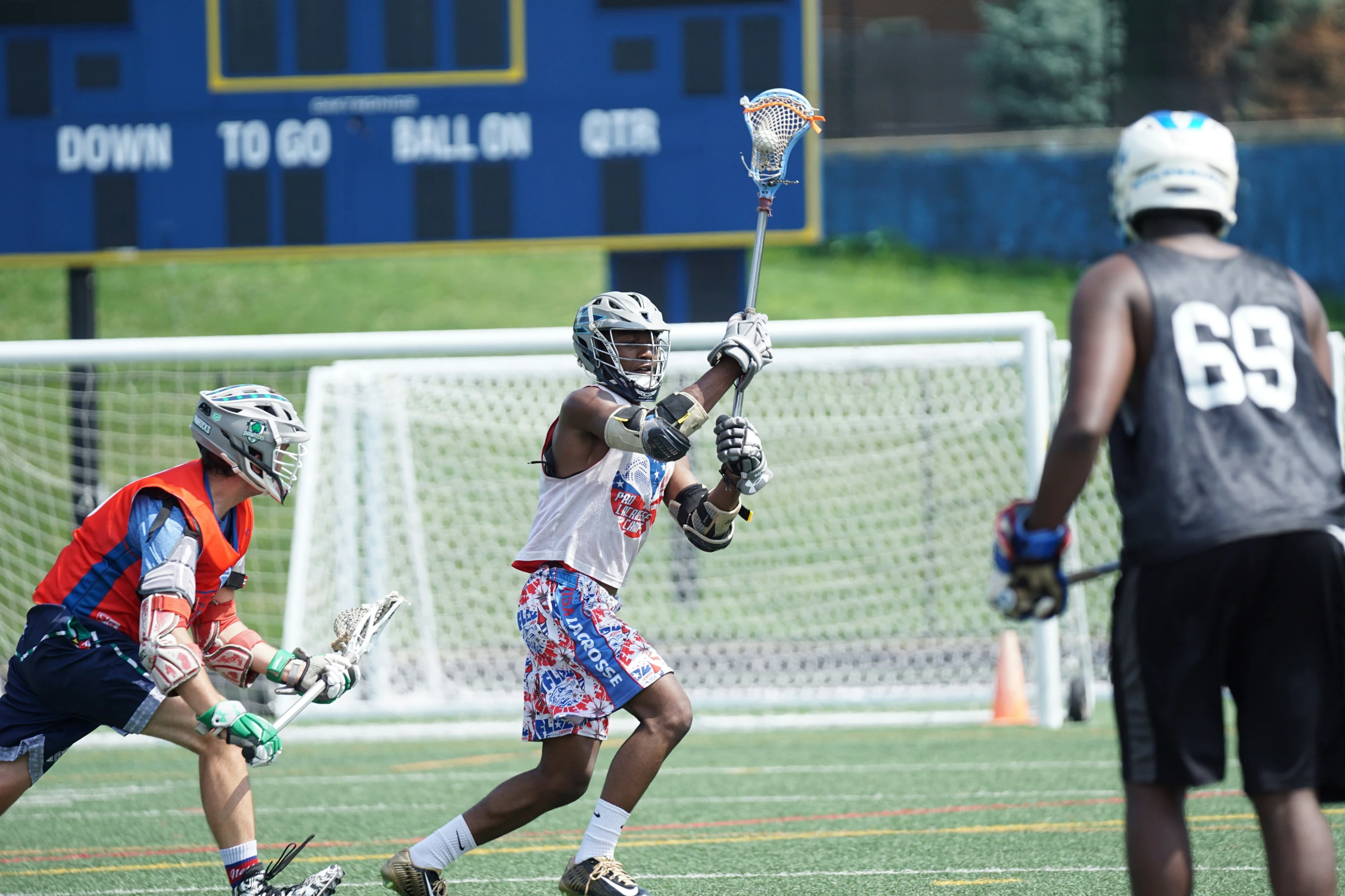 an image of a goalie playing lacrosse with a man behind him