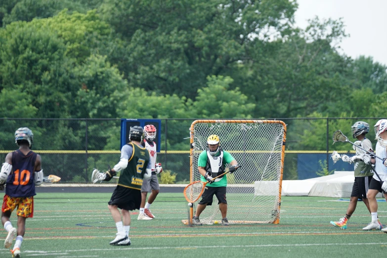 a group of men on a field playing lacrosse