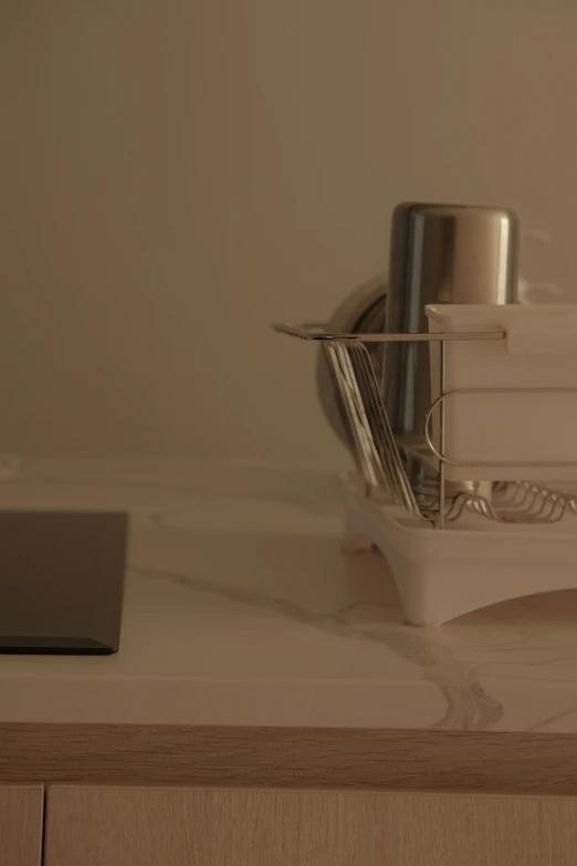 a small silver blender on top of a white counter