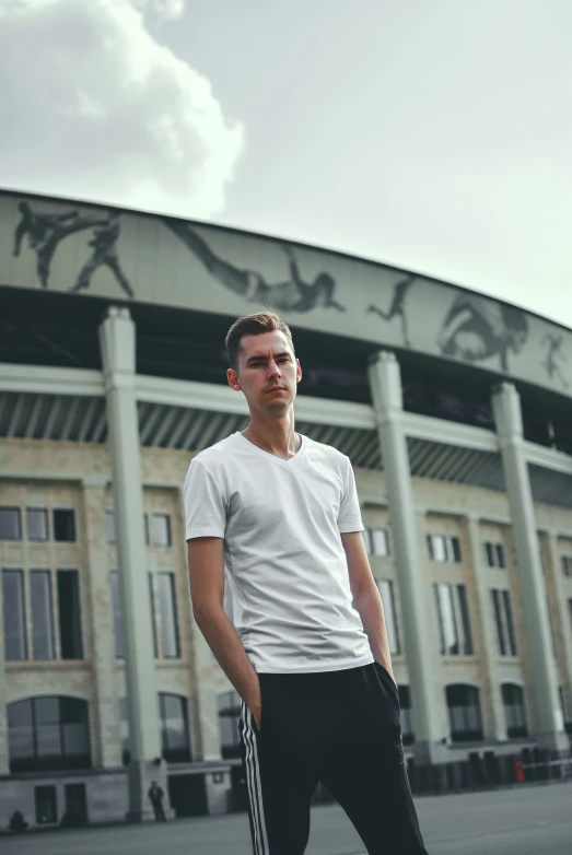 man standing outside soccer stadium looking at camera