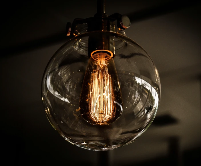 a light bulb that is inside of a glass bowl