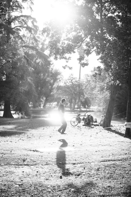 black and white pograph of man doing skateboarding trick