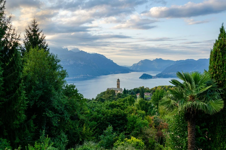 an overlook point with trees, water and mountains