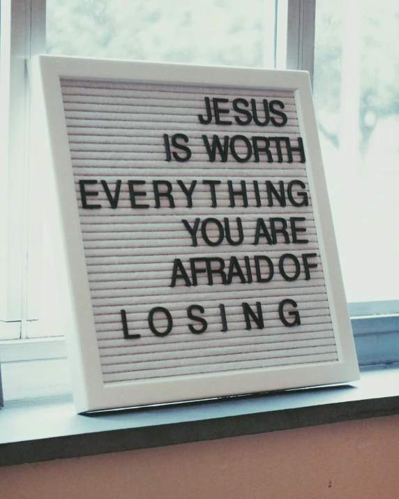 a sign with a message on it that says jesus is worth