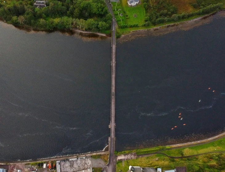 an aerial view of the city of vancouver with a bridge over a lake