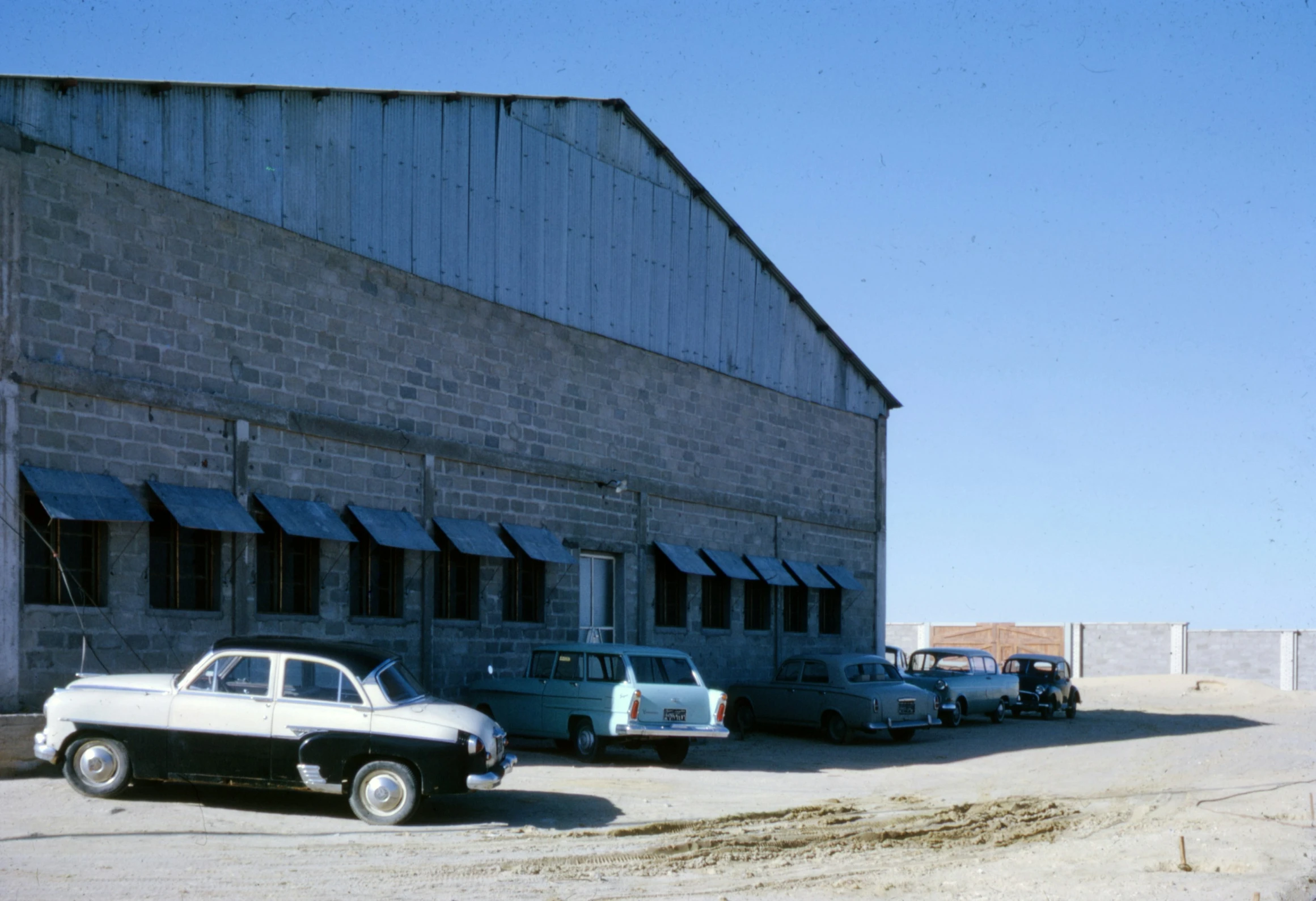 this is an old po of a car and truck garage