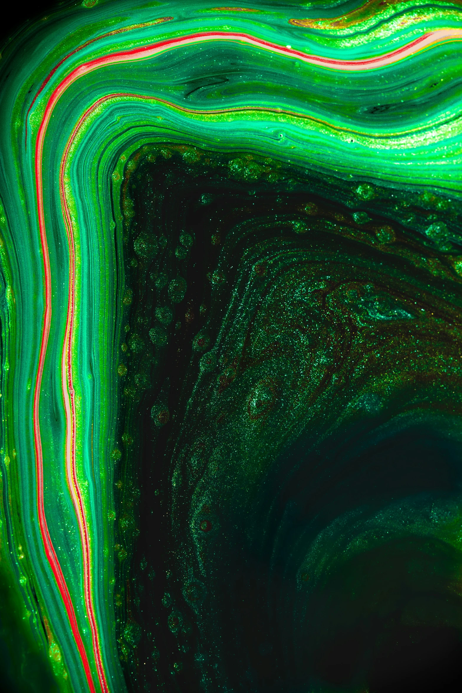 an abstract art image in green, red, and yellow