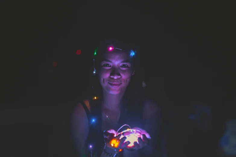 a girl wearing some kind of light up costume