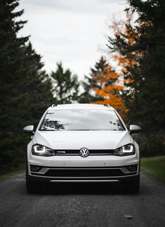 a white car that is on a road