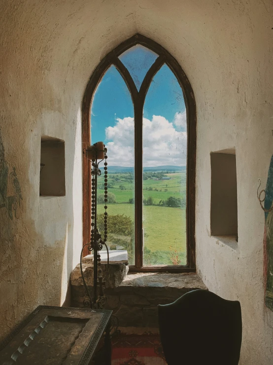 a very big pretty window in a large room