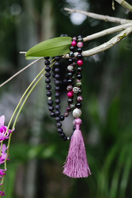 a bunch of beads attached to a tree