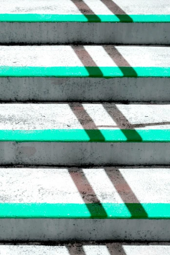 an image of a street bench with green slats