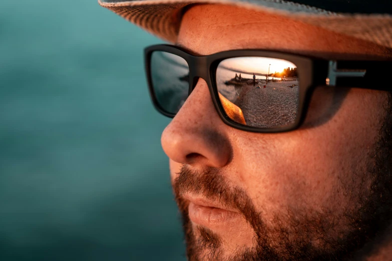 a man's reflection in a pair of glasses