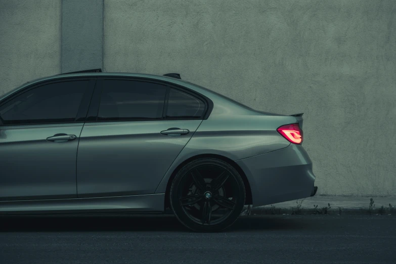 a dark gray car with a light on it