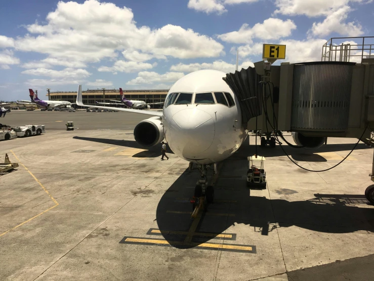 a large jet liner sitting on top of an airport runway