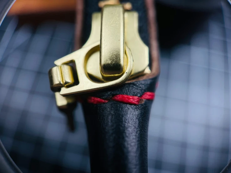 a bike seat with some gold parts attached