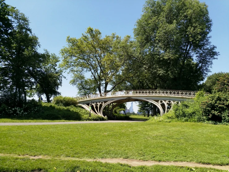 an old, bridge that has the people on it