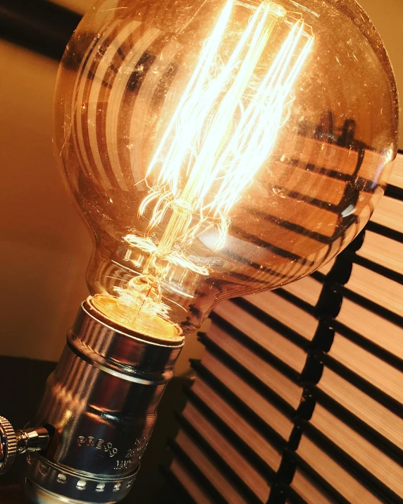 a light bulb sitting on top of a wooden table