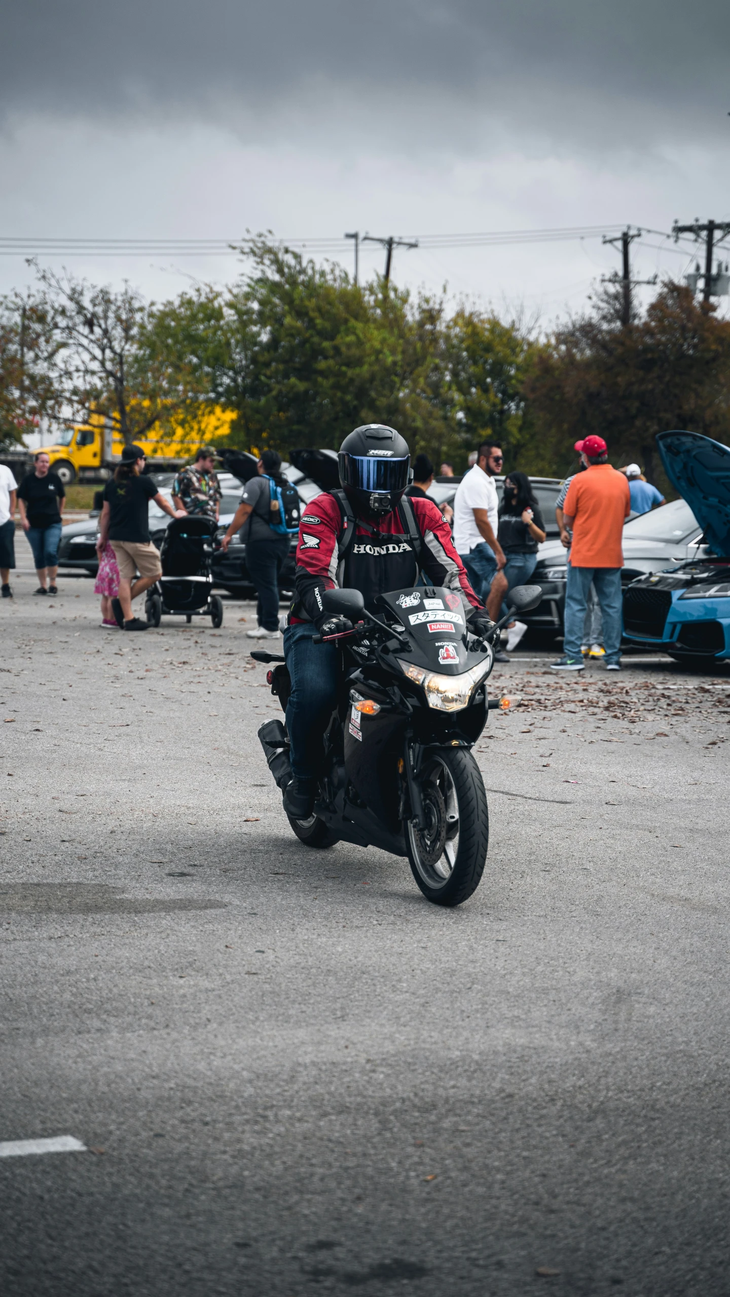 a man riding a motorcycle on top of a road