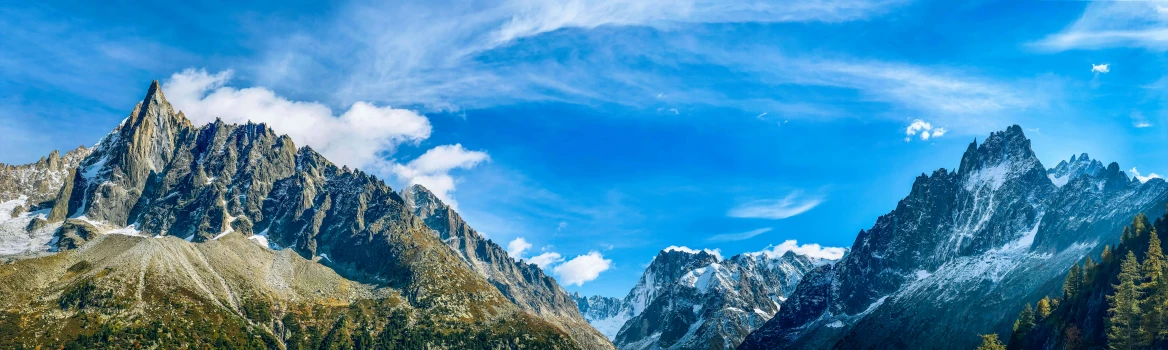 a bunch of mountains on a cloudy day