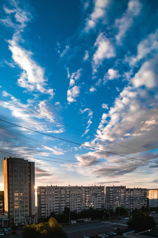 the clouds are all over the city at sunset