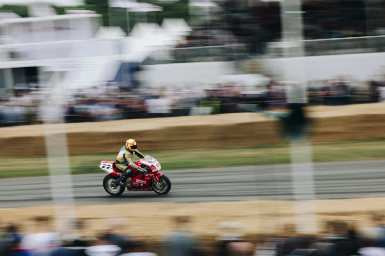 a motorcycle race with a man riding on the track